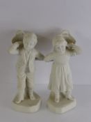 A Pair of Antique Bisque Figures, depicting a boy and a girl carrying a basket, impressed nr to base