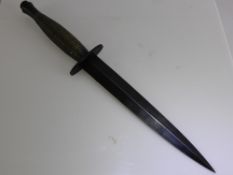 A Fairbairn-Sykes Third Pattern Fighting Knife, the knife with blued 7" double edged blade, ribbed