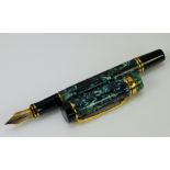 A Vintage Parker Ink Pen. The green marbled pen having an 18k gold nib with original box and