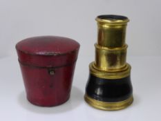 An Antique Dolland London Four Draw Opera Glass. The glass having an ebony case with the original