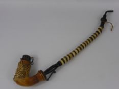 An Antique German Long Stem Pipe, the bowl with decorative carving depicting a stag, approx 49 cms.