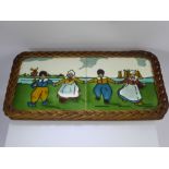 Two Vintage Dutch Ceramic Tiles, depicting characters dancing, the tiles set in a wicker frame,