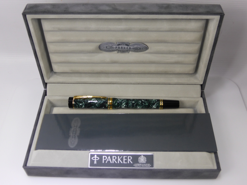 A Vintage Parker Ink Pen. The green marbled pen having an 18k gold nib with original box and - Image 2 of 2