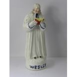 A Victorian Staffordshire Figure, Reverend John Wesley modelled preaching, on a circular base,