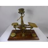 A Pair of English Brass Postal Scales, with weights together with a brass candle holder in the
