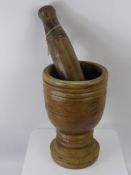 A Large Vintage Wood Carved Pestle and Mortar, of Turkish origin, approx 30 cms high.