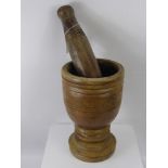 A Large Vintage Wood Carved Pestle and Mortar, of Turkish origin, approx 30 cms high.