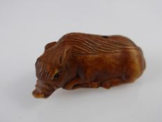 A Japanese Netsuke, in the form of a sow, approx 3 cms, with character marks to base.