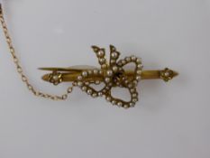 A Lady's 9 ct Gilded Seed Pearl Brooch, the brooch in the form of a bow, approx wt 7.5 gms..