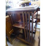 An Edwardian Revolving Book Case, with decorative inlay to the top, approx 51 x 92 cms.