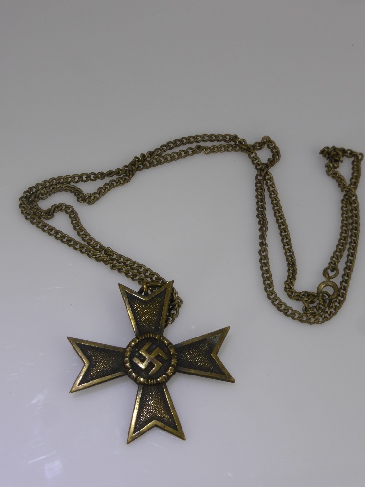 A German WWII Iron Metal Cross Medallion on Chain.