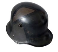 A German WWI M16 Camouflage Remscheid-Hasten Helmet, the helmet having leather sizing band and