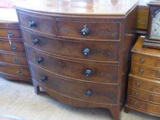 A Mahogany Chest of Drawers, bow fronted with two short and three long drawers, mother of pearl