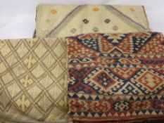 Three Turkish Yastiks, one Kilim style, approx 62 x 45 cms, one other 85 x 50 cms, one 95 x 60