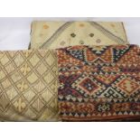 Three Turkish Yastiks, one Kilim style, approx 62 x 45 cms, one other 85 x 50 cms, one 95 x 60