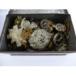 A Tin Containing a Collection of Military Badges etc., approx 100 items.