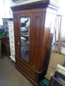 An Edwardian Mahogany Single Wardrobe, glazed fronted door with bevel mirror single drawer