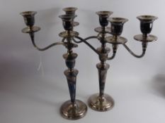 A Pair of Three Branch Silver Plate on Copper Candle Sticks.