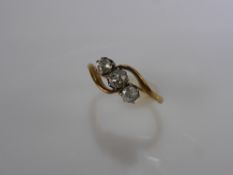 A Lady's 18 ct Rose Gold and Platinum Three Stone Diamond Ring. 1 x 16 pt and 1 x 12 pt old cut dias