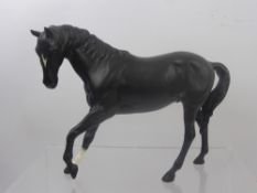 Two Beswick Figures of Horses, a black horse approx 17.5 cms and a chestnut horse, approx 18.5