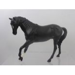 Two Beswick Figures of Horses, a black horse approx 17.5 cms and a chestnut horse, approx 18.5