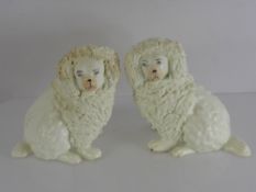 A Pair of Antique Staffordshire Poodles, approx 10.5 cms together with a pair of spaniels approx