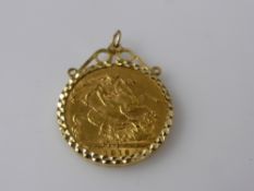 A 1912 Full Gold Sovereign, in 9 ct gold mount, total approx wt 9.0 gms.