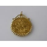 A 1912 Full Gold Sovereign, in 9 ct gold mount, total approx wt 9.0 gms.