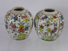 A Pair of Ginger Jars, hand painted with floral decoration, approx 9 cms (2)