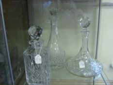 Three Crystal Decanters, including two Edinburgh crystal and one cut glass ship's decanter.