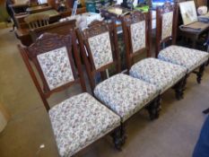 A Set of Six Mahogany Edwardian Dining Chairs, upholstered in tapestry.