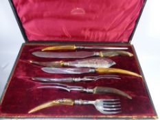 An Antique Williamson & Sons Cutler's Silver Mounted Horn Carving Set, in the original box.