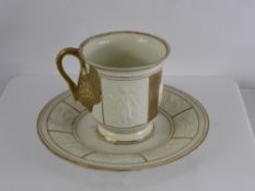 An Antique Capo di Monte Commemorative Cup and Saucer, decorated with raised classical scenes,