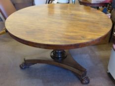 A Victorian Tilt Top Rosewood Dining Room Table, the table on turned column support with lion claw