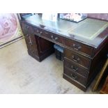 A Reproduction Mahogany Office Desk, the desk with green tooled leather insert, with four short