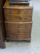 A Miniature Mahogany Chest on Chest, the chest having two drawers on top with three below, approx 31