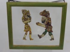 An Antique Indian Silhouette, depicting two figures which appear to be made from pierced skin with