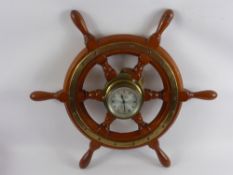 A Celeste Eight Day Wall Clock, in the form of a ship's wheel.