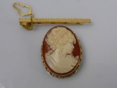 A Lady's Shell Cameo, Grecian profile in a 9 ct hallmarked gold mount, together with a 9 ct