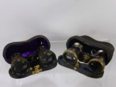A Pair of Mother of Pearl Opera Glasses, together with a further pair of opera glasses in the