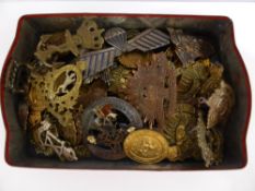 A Tin Containing a Collection of Commonwealth Military Badges, including South African, Canadian and