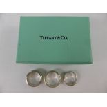 Three Solid Silver Tiffany & Co Rings, two 1997, one size O the other size M and one 1999 size J,