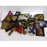 A Collection of WW2 Period Medals (Pacific Star) Badges and formation signs.