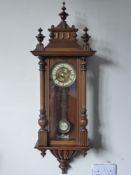 A Vienna Wall Clock, the clock with brass enamel face and Roman dial, approx 100 cms. (af)