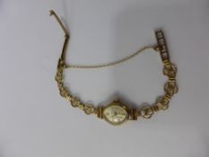 A Lady's 9ct Gold Accurist Cocktail Watch, mounted on a 9ct Gold Bracelet, approx 10.3 gms