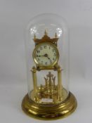 A Brass Twin Column Mantel Clock, with four weight pendulum, the clock having white enamel face with