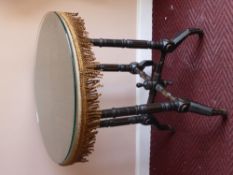 A Black Lacquer Round Occasional Table, celadon green silk top, on tripod base.