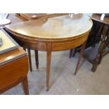An Edwardian Folding Card Table, with burgundy baize and decorative inlay, on tapered legs (wf),