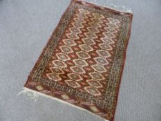 A Hand Knotted Turkmen Rug, approx 120 x 80 cms.