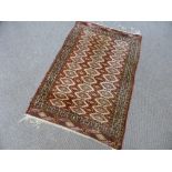 A Hand Knotted Turkmen Rug, approx 120 x 80 cms.